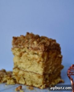 Close-up of the coffee cake's crumble topping, appearing hard and uneven