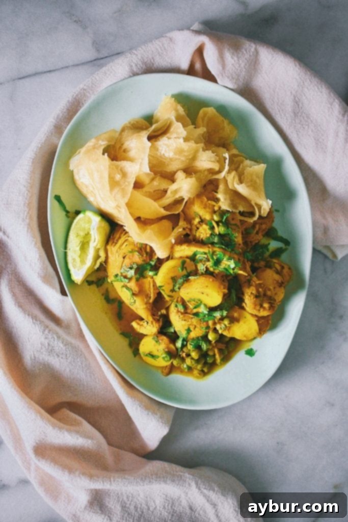 Freshly made Roti Buss-up-shut flatbreads served with Curry Chicken