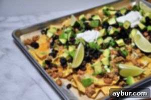 Perfect Movie Night Sheet Pan Nachos 4 Overhead view of a finished nacho platter, ready to be served and enjoyed