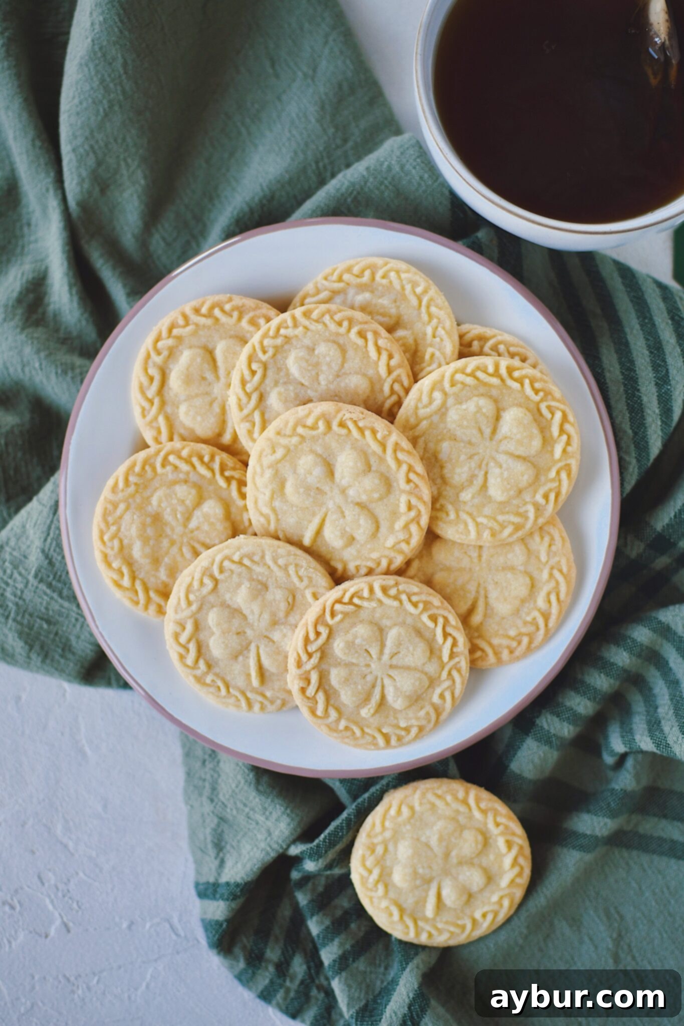 Irish Shortbread cookies on a plate with a cuppa tea nearby ready to be enjoyed!