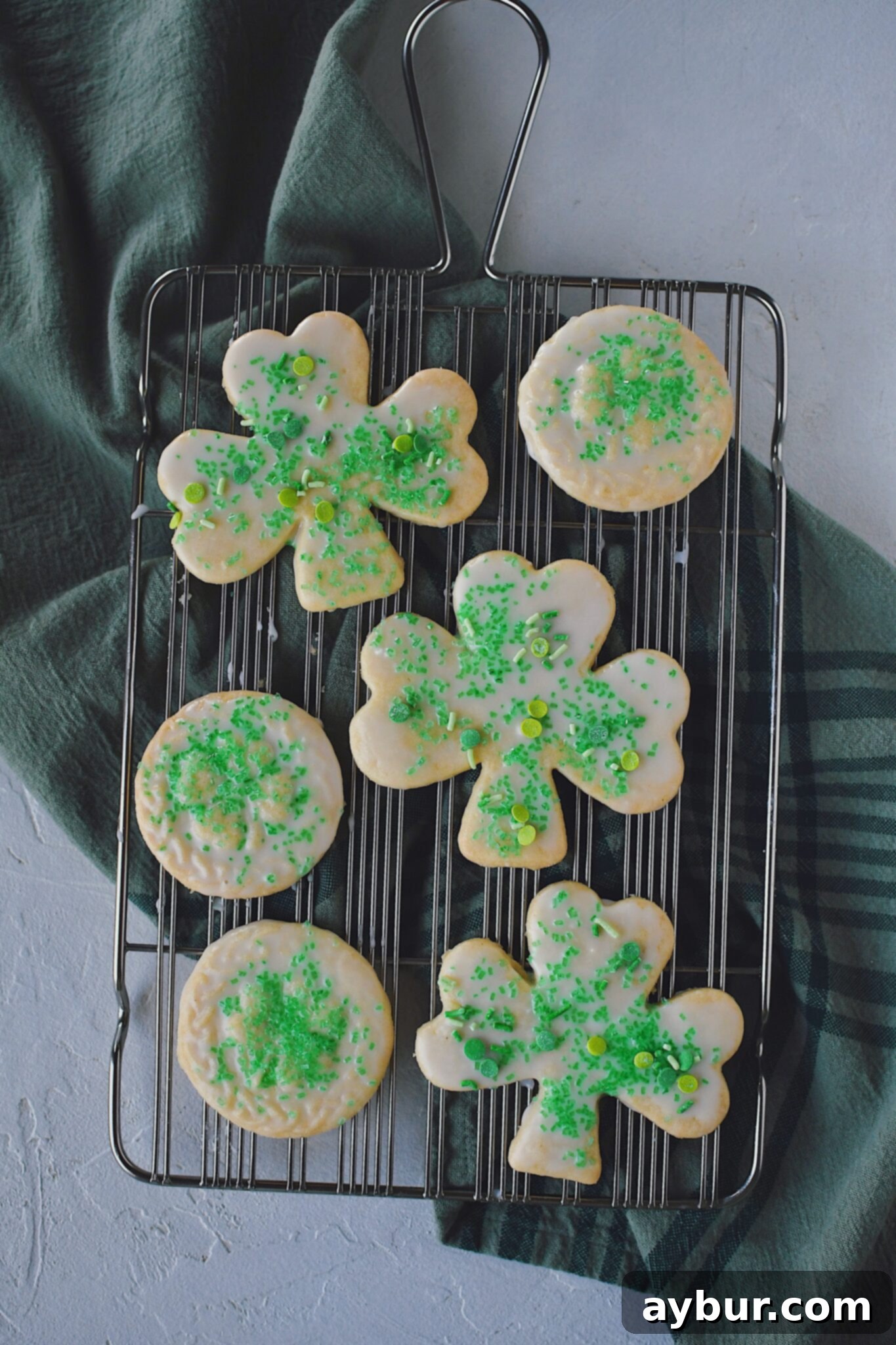 Irish Shortbread dipped in a powdered sugar glaze and sprinkled with green sugar and sprinkles.