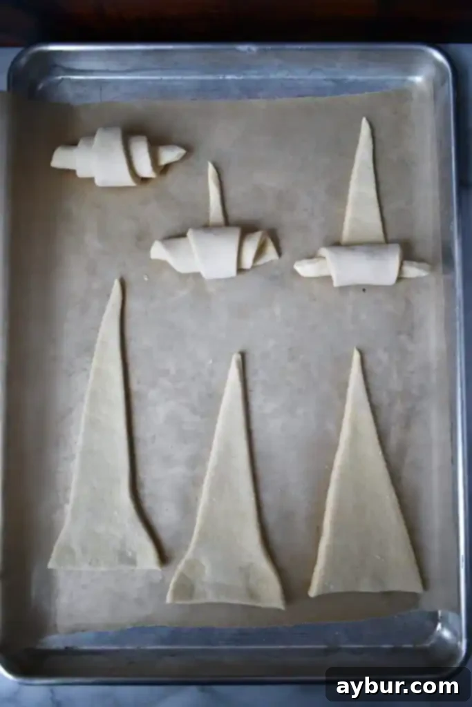 Homemade Bakery Croissants 3 Croissant dough being formed into its characteristic crescent shape