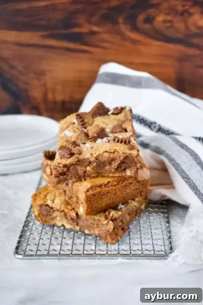 Freshly baked Peanut Butter Blondies cooling on a wire rack