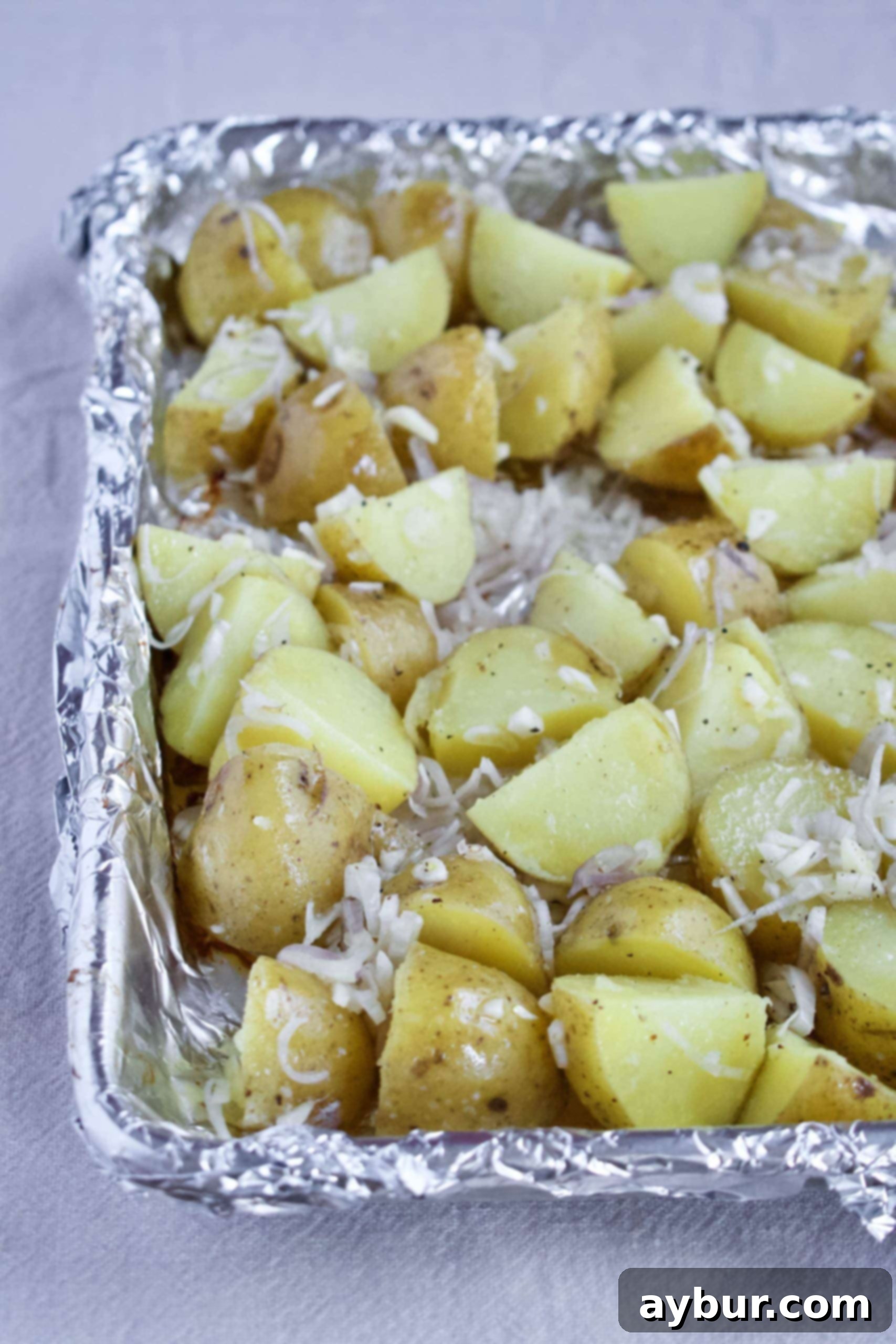 Golden Herb Roasted Potato Salad 3 Parboiled and seasoned small Yukon Gold potatoes, ready for roasting.
