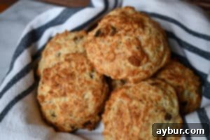 Freshly baked golden brown drop biscuits with bacon and Gruyère cheese