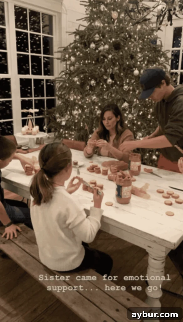 The whole Gaines family making homemade Christmas candy together.