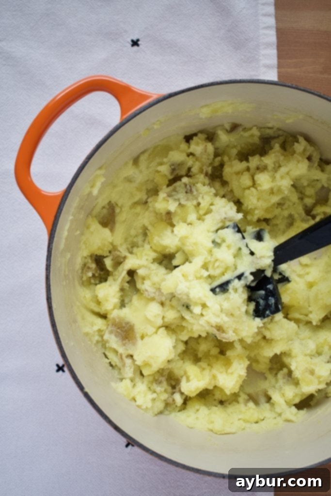 Freshly cut Irish potato farls on a wooden board.