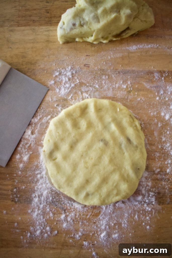 Irish potato farls cooking on a hot griddle.