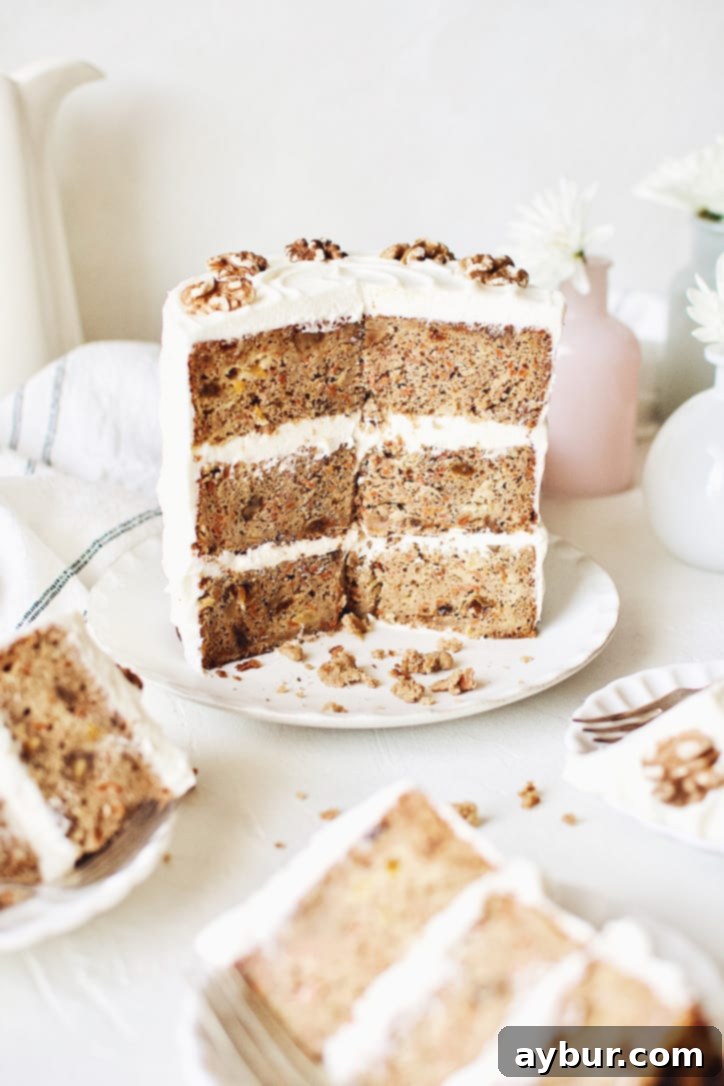 A beautifully assembled Carrot Cake with Pineapple and Orange, generously frosted with cream cheese frosting.