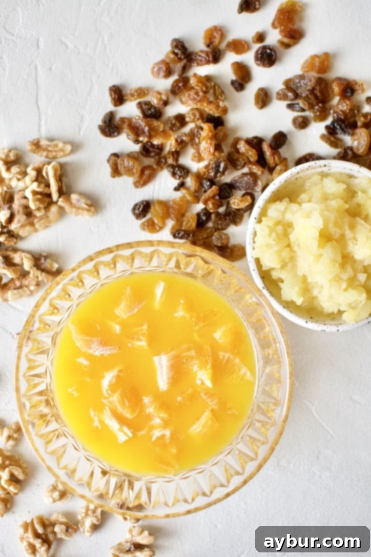 Freshly diced oranges, crushed pineapple, and golden raisins, soaking in juice.