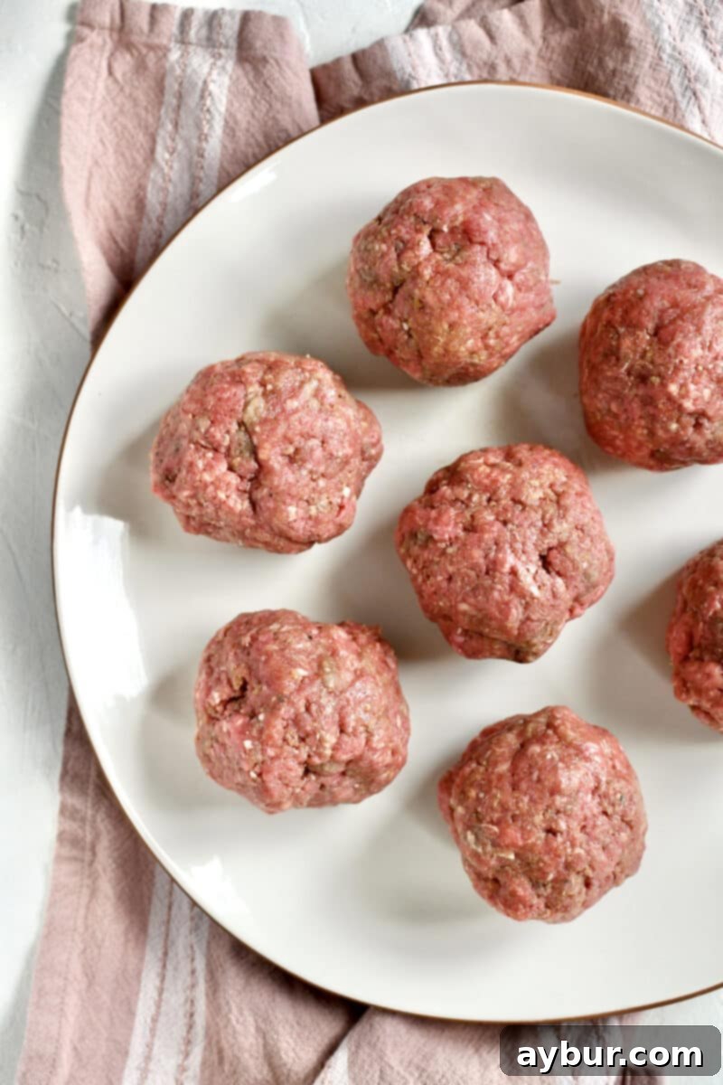 Portioned out burgers in 6 ounce balls.
