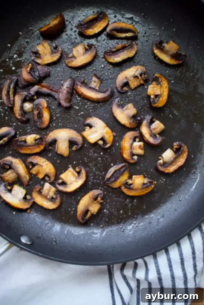 Sauteed Crimini Mushrooms, browned and crisped and ready to top the burgers