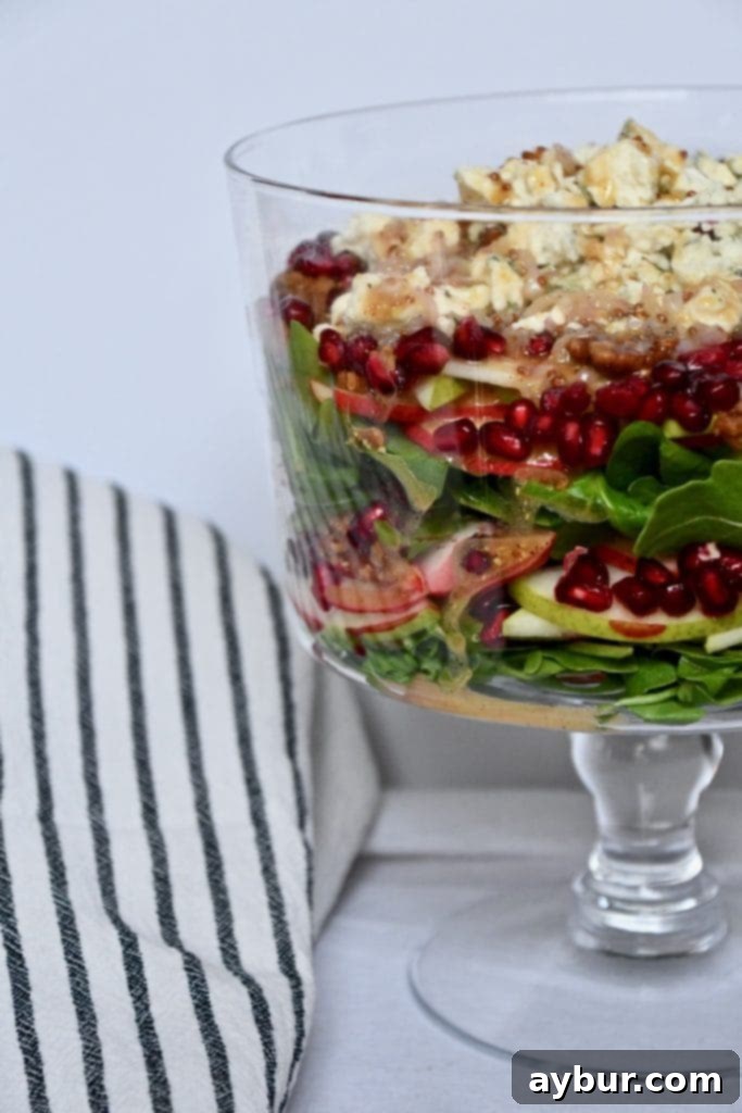 Festive Layered Arugula Salad with Pear Vinaigrette 2 Joanna Gaines' Layered Arugula Salad with Pear Vinaigrette, showcasing vibrant colors and fresh ingredients