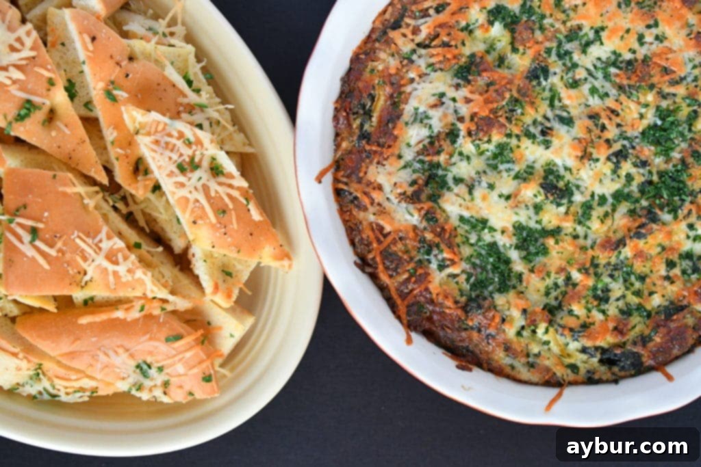 Freshly baked spinach and artichoke dip in a rustic baking dish, ready to be served.