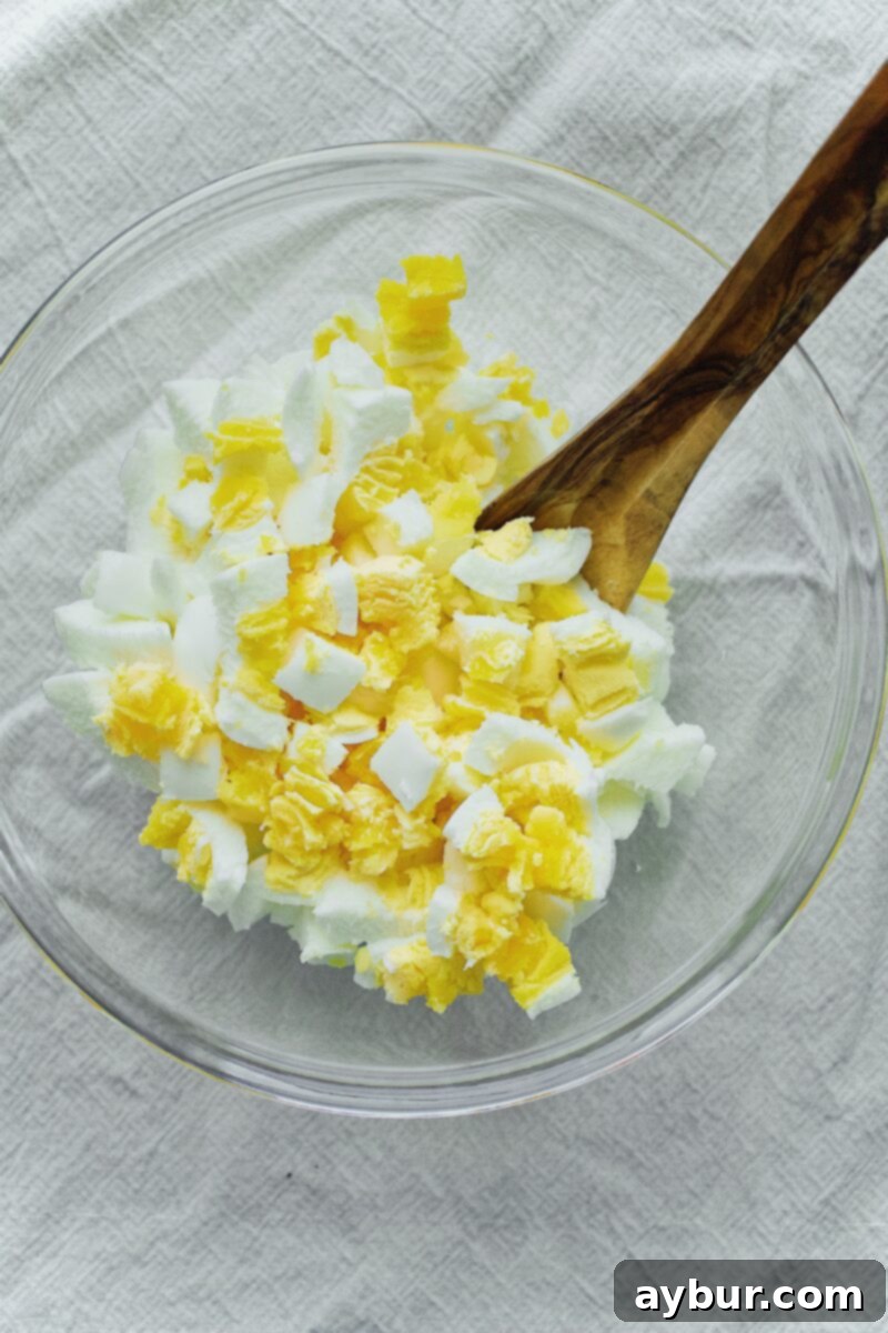 Scandinavian Dill Egg Salad 6 Close-up of perfectly diced eggs in a bowl, ready for mixing.