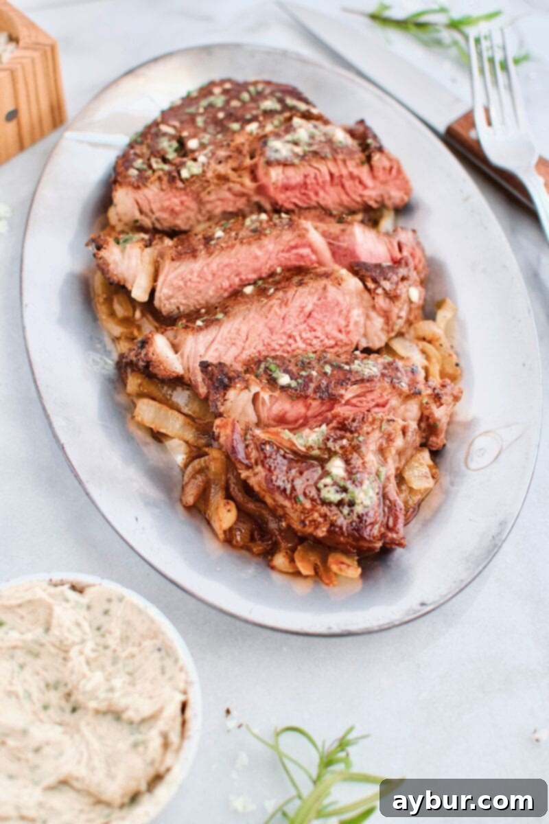 Grilled Ribeye Steak topped with Steak Butter