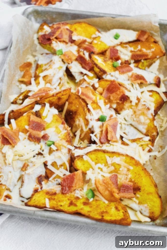 Turmeric Gold Cheesy Fries 2 Turmeric Cheese Fries topped with Bacon, Cheese Sauce, Jalapeno pieces, and white cheddar