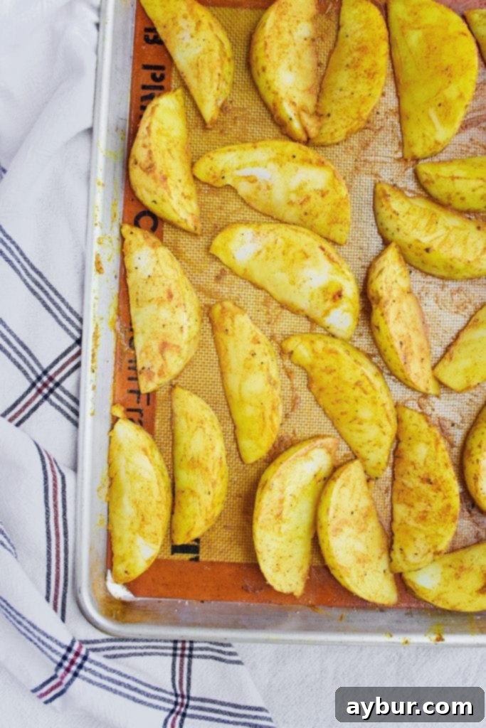 Turmeric Gold Cheesy Fries 3 Turmeric coated potato wedges, before cooking