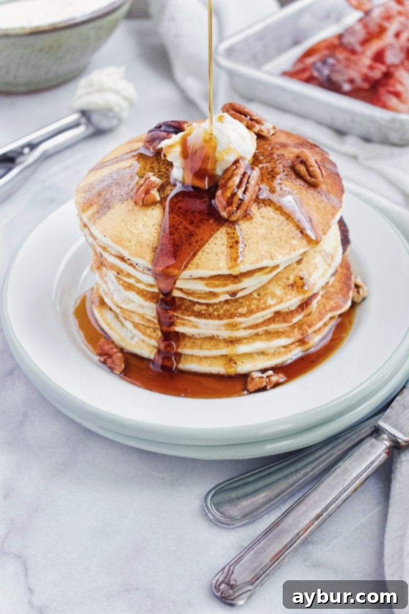 Joanna Gaines Pecan Pancakes with Maple Butter, beautifully plated with rich maple butter melting