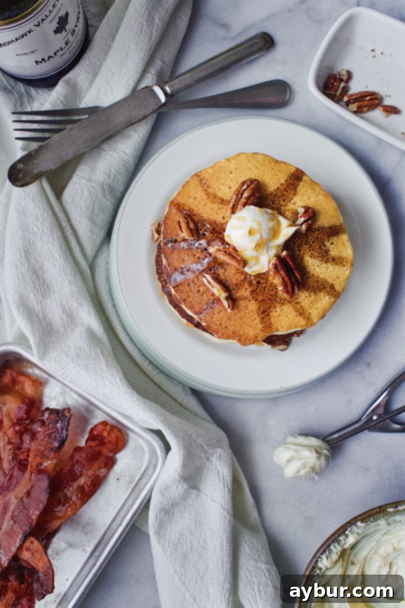 A close-up of Joanna Gaines Pecan Pancakes, showcasing the texture and pecans