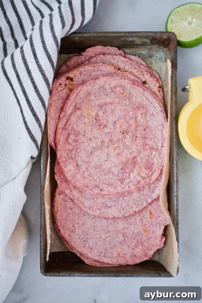 Joanna Gaines Corn Tortilla recipe made with blue cornmeal, showcasing perfectly round, soft, and visually appealing tortillas.