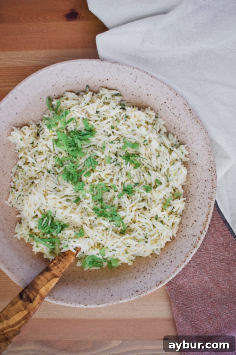 Joanna Gaines Cilantro Lime Rice, perfectly cooked, fluffy, and generously garnished with fresh cilantro, ready to be served.