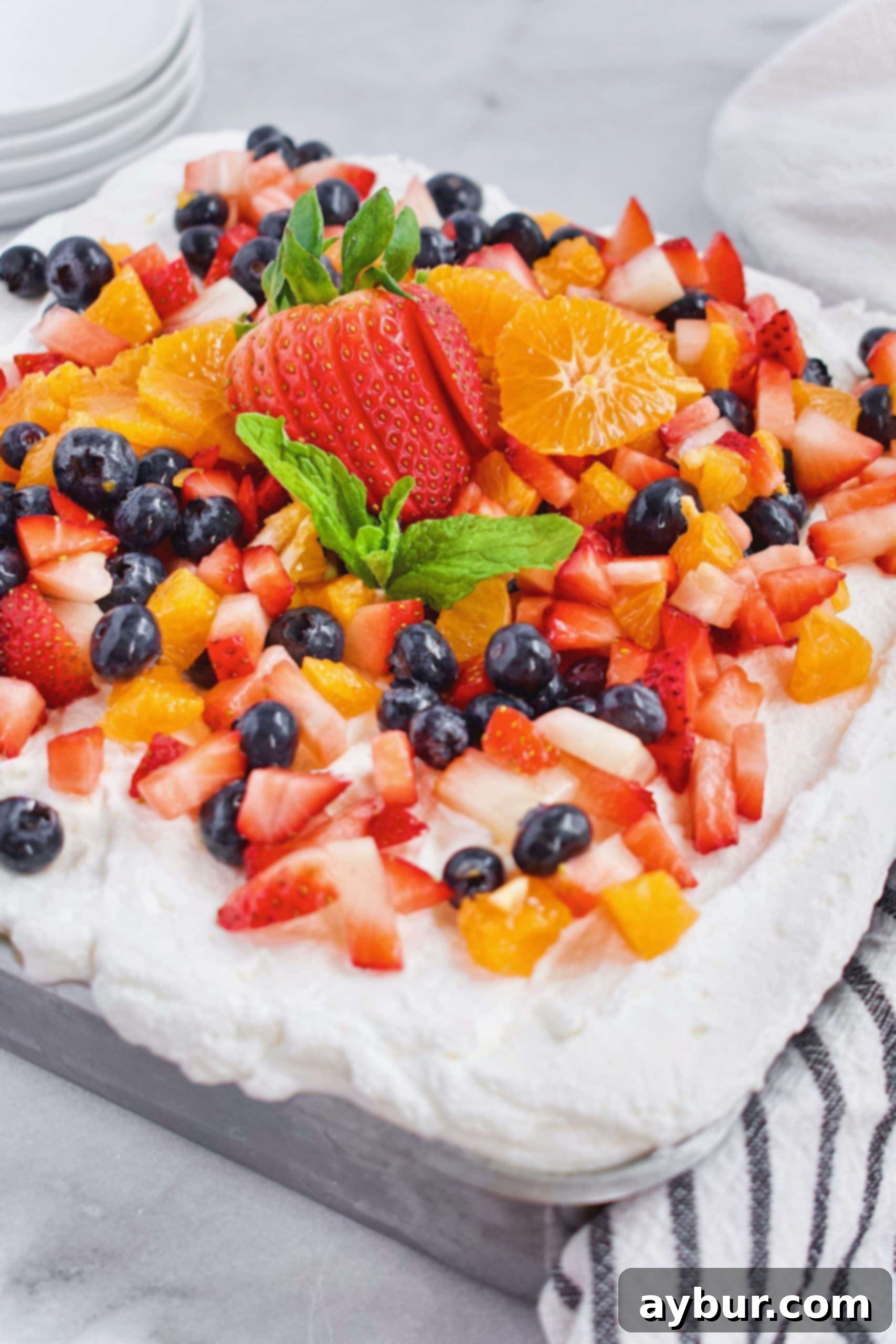 Tres Leches Your Theme Night's Sweet Sensation 5 Tres Leches Cake with various fresh fruits and a sprinkle of cinnamon