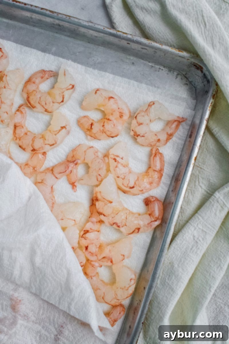 Zesty Lemon Garlic Grilled Shrimp Skewers 4 Thawed shrimp drying between paper towels