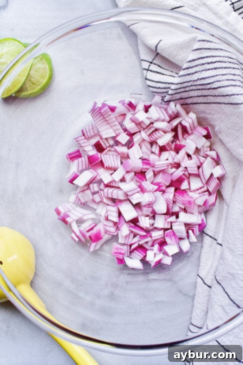 red onions marinating in lime juice for chicken salad