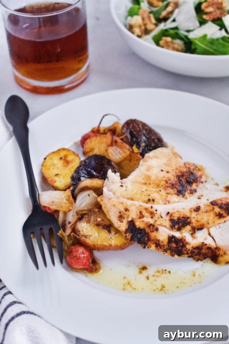 Joanna Gaines Whole Roast Chicken served on a plate with vegetables
