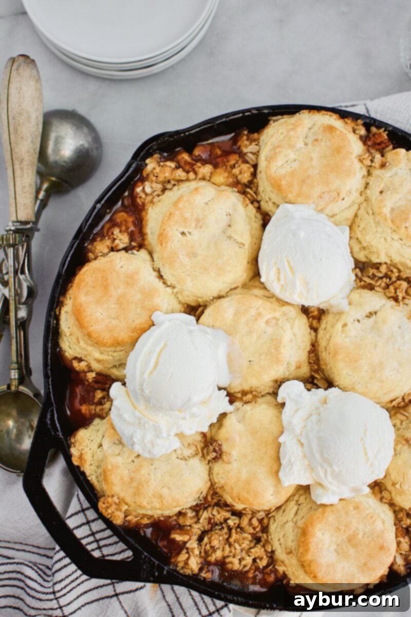 Rustic Skillet Peach Cobbler with Sweet Brown Sugar Crumble 4 Another view of the Skillet Peach Cobbler, highlighting the golden biscuit topping and crumble.