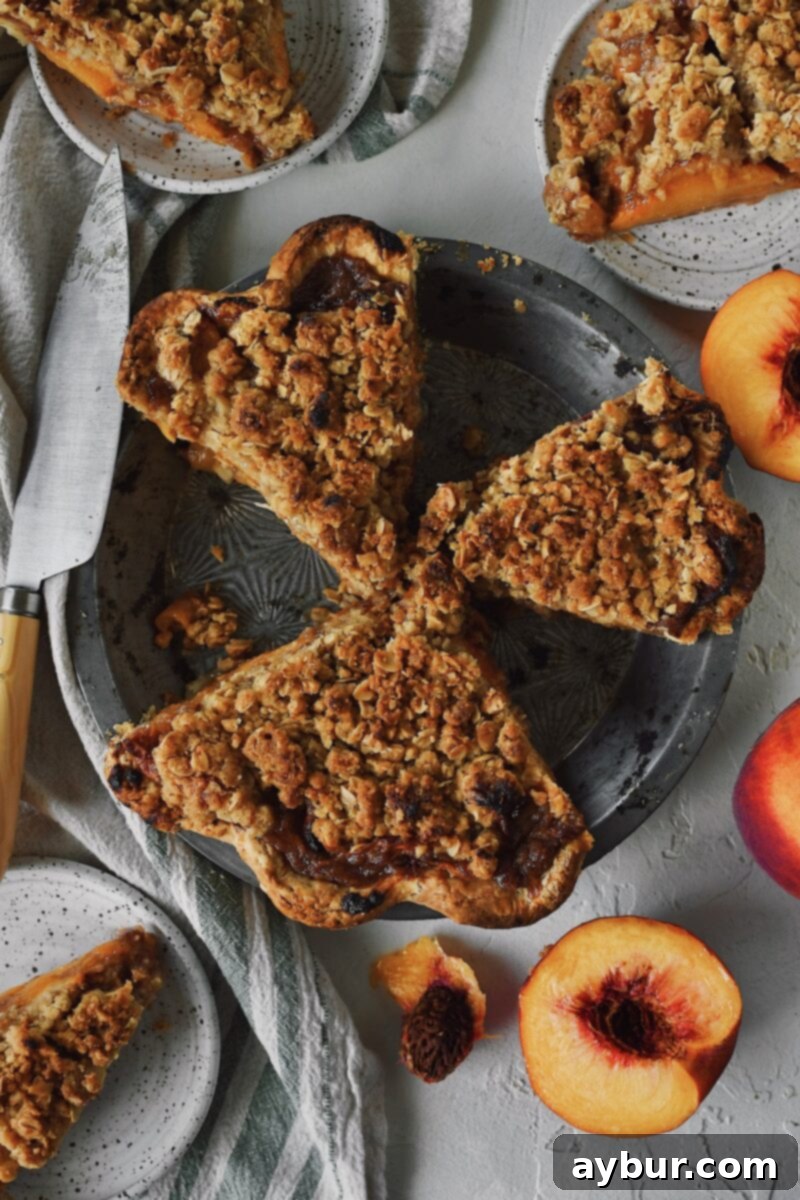 Warm Spiced Peach Crumble 3 Looking closely into the pie tin at the spiced peach pie.