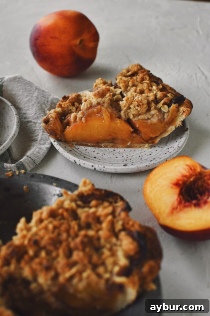 Warm Spiced Peach Crumble 5 Looking at the side of a slice of spiced peach pie.