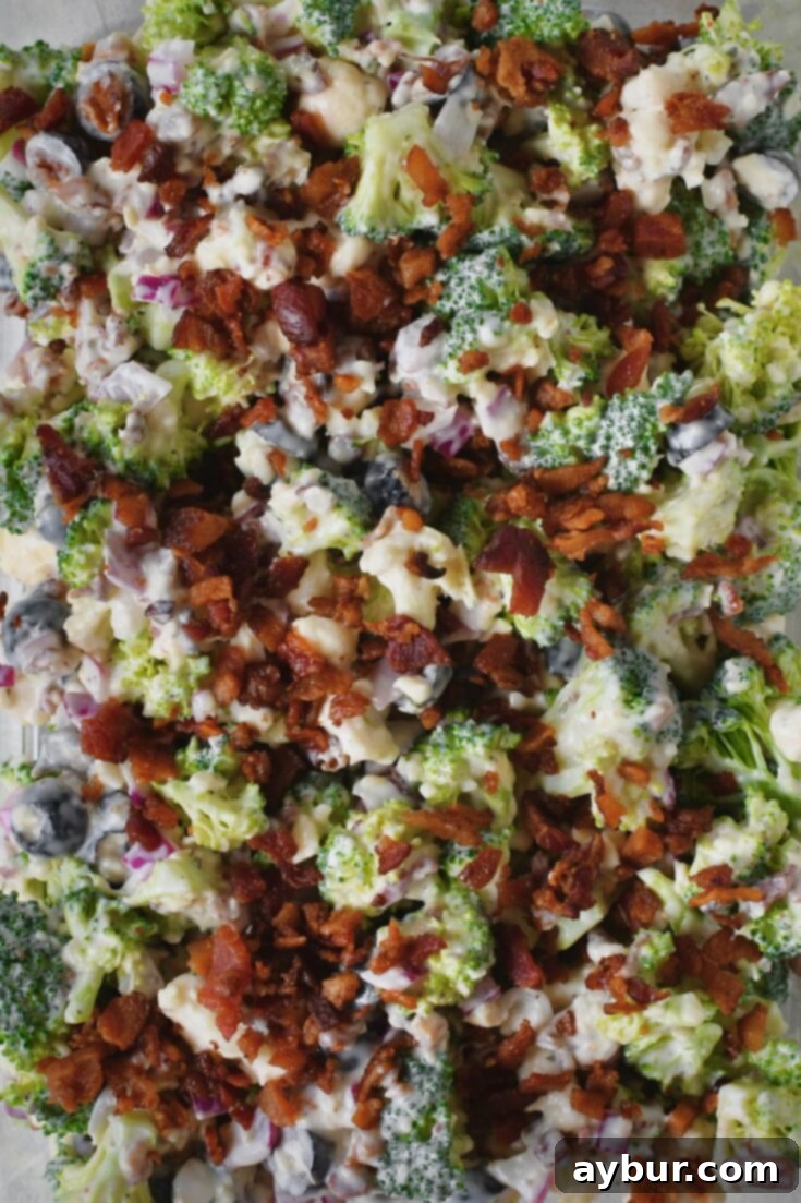 Vibrant Broccoli and Cauliflower Power Salad 12 Finished Broccoli and Cauliflower Salad with a garnish of bacon on top.