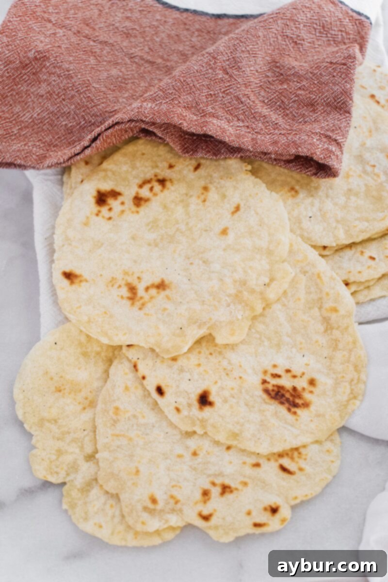 Joanna Gaines recipe for Homemade Flour Tortillas - A stack of freshly made flour tortillas, warm and ready to be filled.