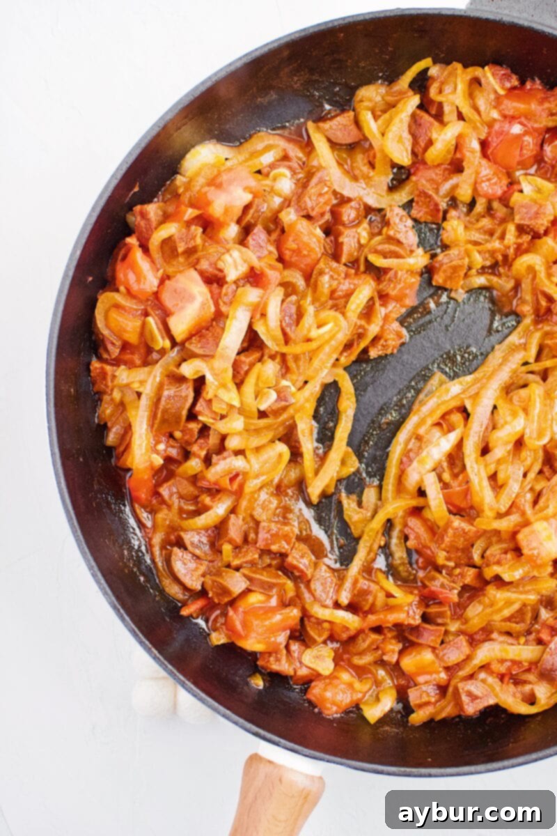 reduced onion, garlic, chorizo, tomato, and white wine