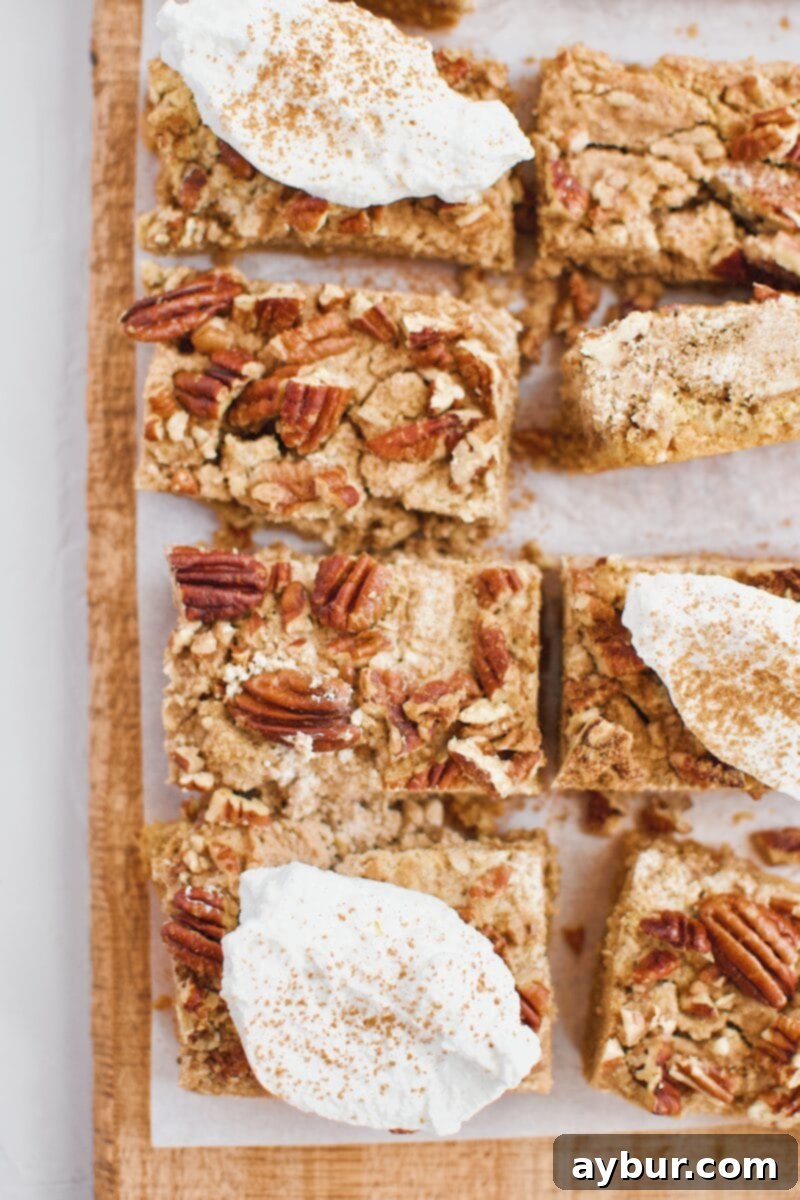 Spiced Pumpkin Bars 9 A festive platter of Pumpkin Dessert Bars, each perfectly cut and ready to be served at a gathering.