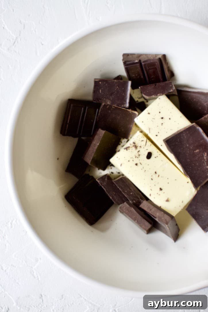 Decadent Fudgy Walnut Brownies 3 Unmelted chocolate and butter pieces in a mixing bowl