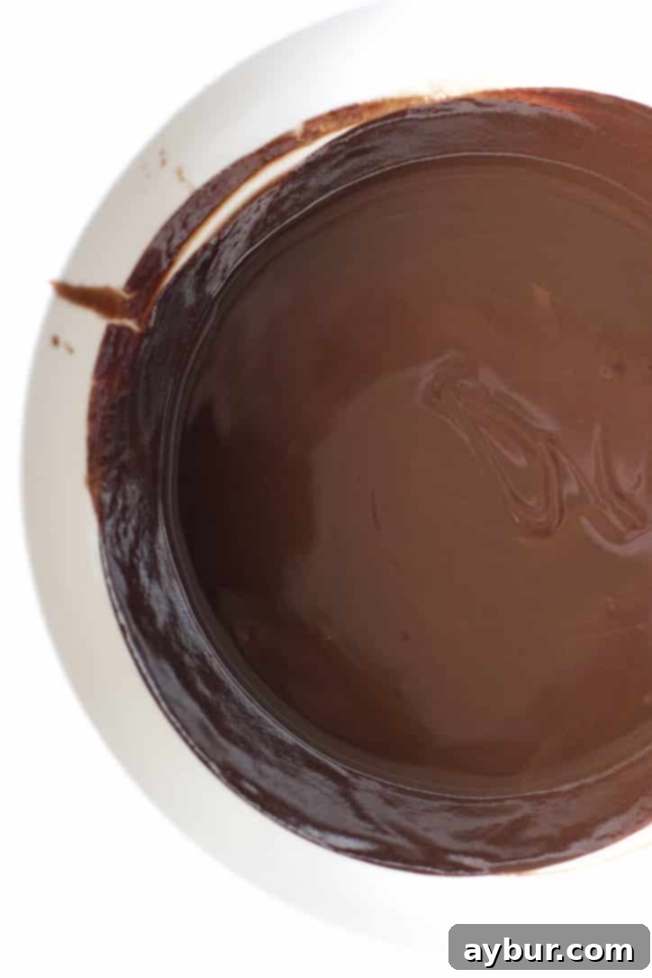 Decadent Fudgy Walnut Brownies 4 Melted chocolate and butter in a bowl, smooth and glossy