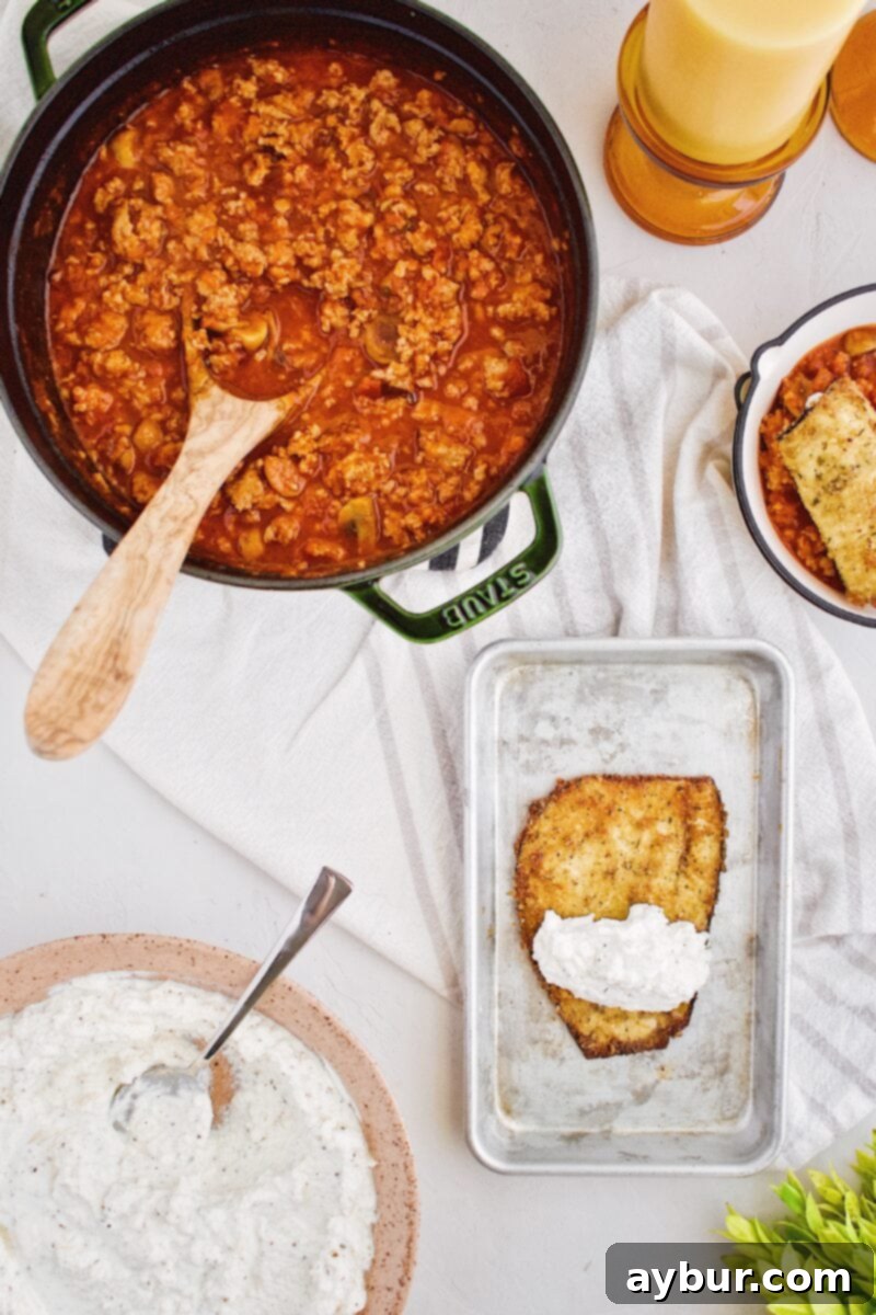 Filling and rolling the delicate eggplant slices with creamy ricotta