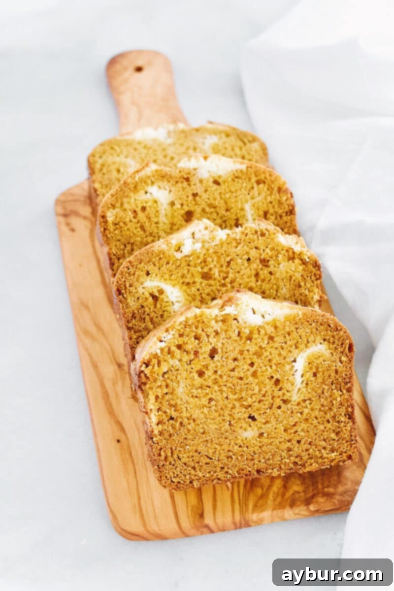 Overhead shot of Joanna Gaines Pumpkin Cream Cheese Loaf, emphasizing the golden crust and inviting texture.