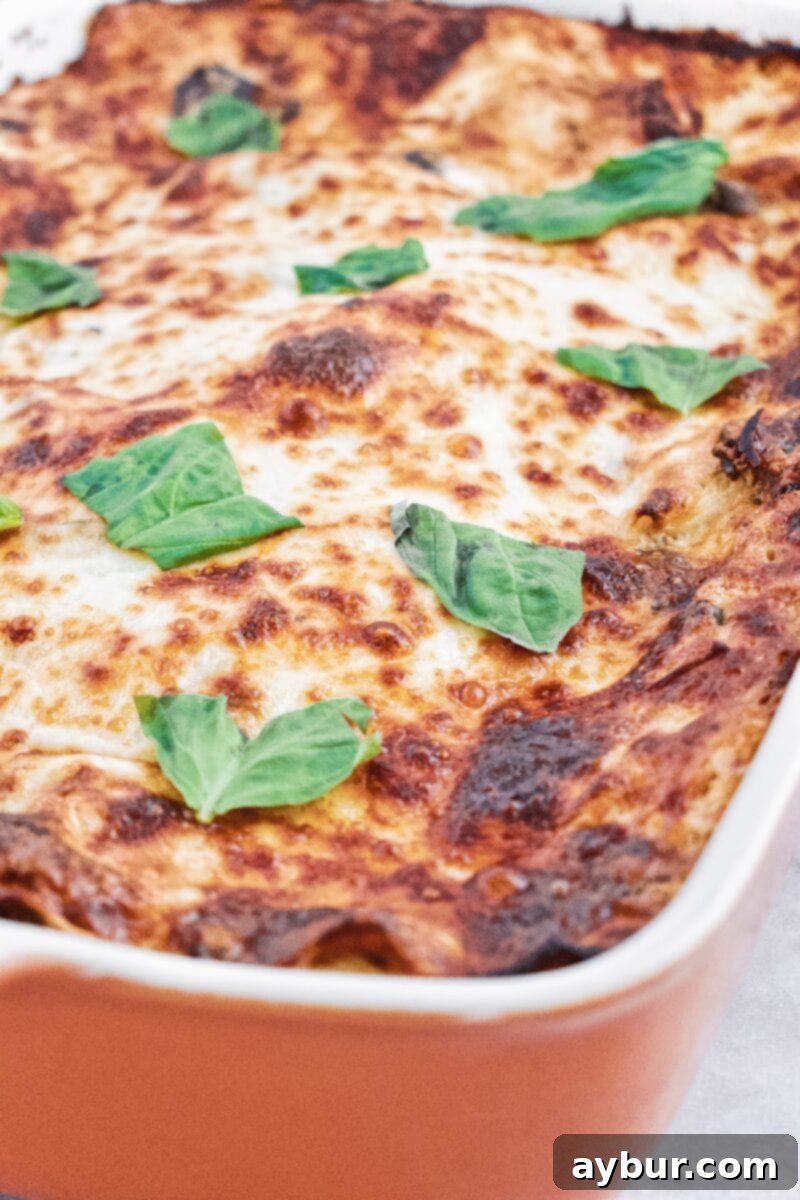 A full tray of Joanna Gaines' White Vegetable Lasagna, sliced and ready to serve, highlighting its rich, sauceless appeal.