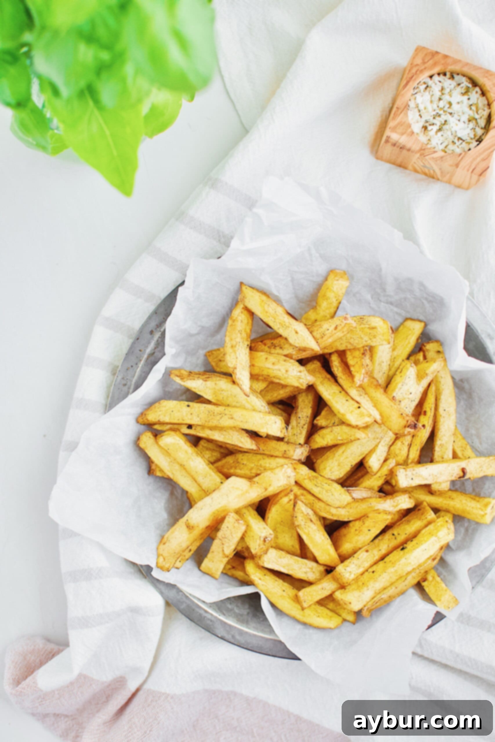 Homemade Fries Made Easy 5 Partially fried Yukon Gold potatoes, cooked once at a lower temperature and draining on paper towels