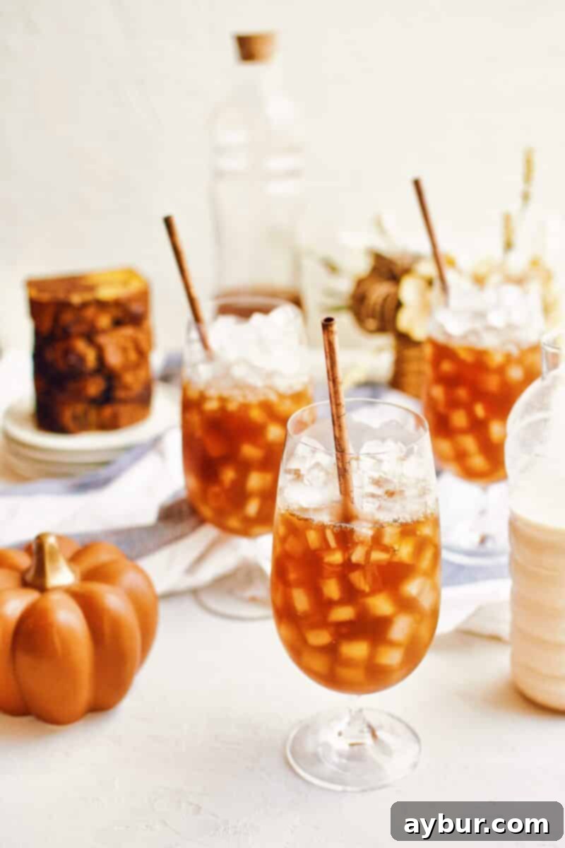 A glass filled with ice and homemade chai tea concentrate, ready for the pumpkin milk.
