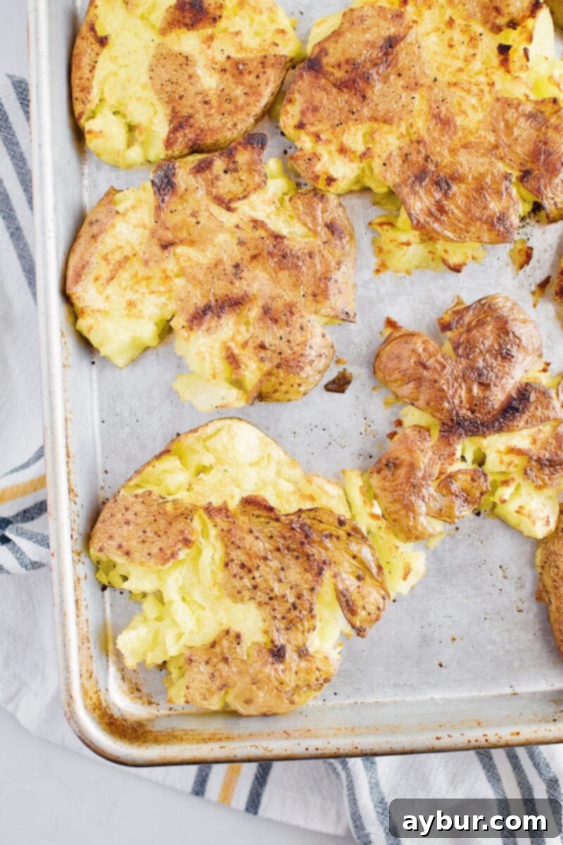 Broiled smashed potatoes, golden brown and crispy, ready for the salad topping
