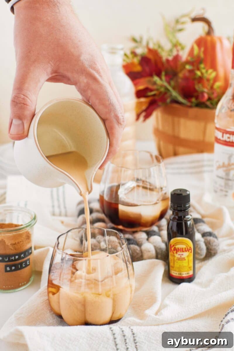 Autumn Spice White Russian 2 Making a pumpkin spice white russian in a pumpkin-shaped glass, beautifully garnished