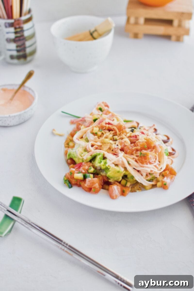 Ahi Tuna Poke bowl recipe, showcasing the deconstructed elements of a tuna tower for a casual serving option.