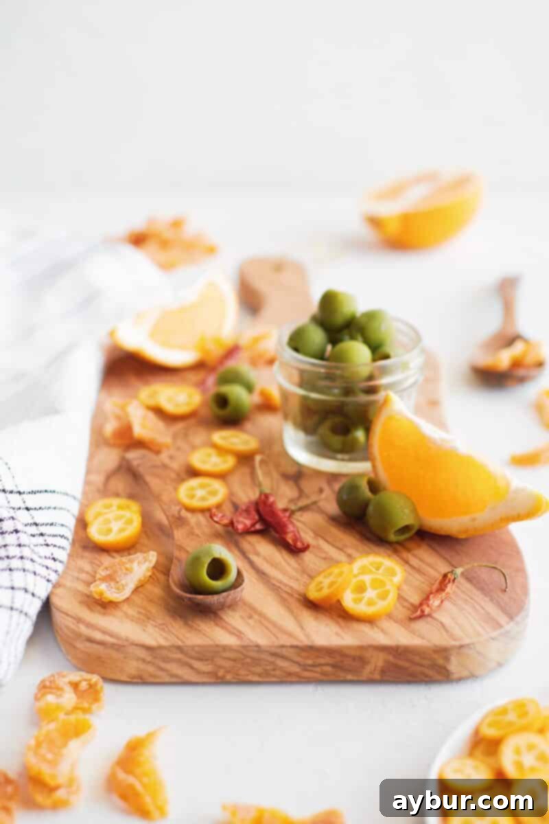 Spicy Citrus Marinated Olives 3 A beautiful flat lay of ingredients needed for marinating olives with citrus and chiles