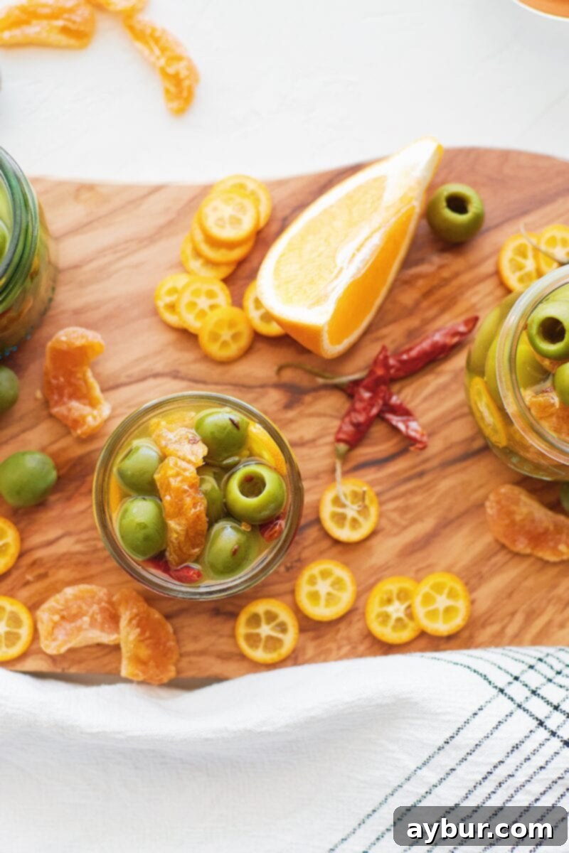 Spicy Citrus Marinated Olives 6 A selection of marinated olives in brine with kumquats and chiles, perfect for a gathering