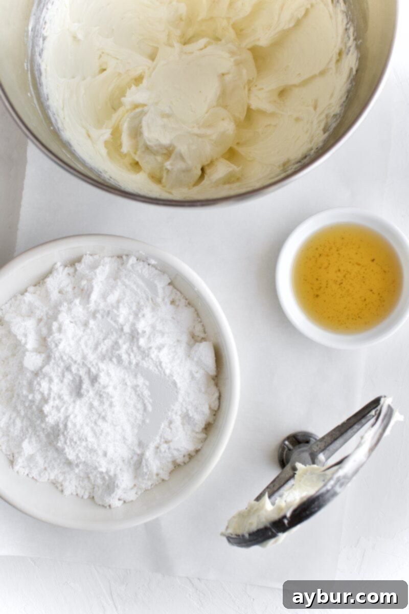 Spiced Pumpkin Walnut Cake with Creamy Cream Cheese Frosting 8 Close-up of cream cheese frosting being made in a stand mixer, showing its light and fluffy texture
